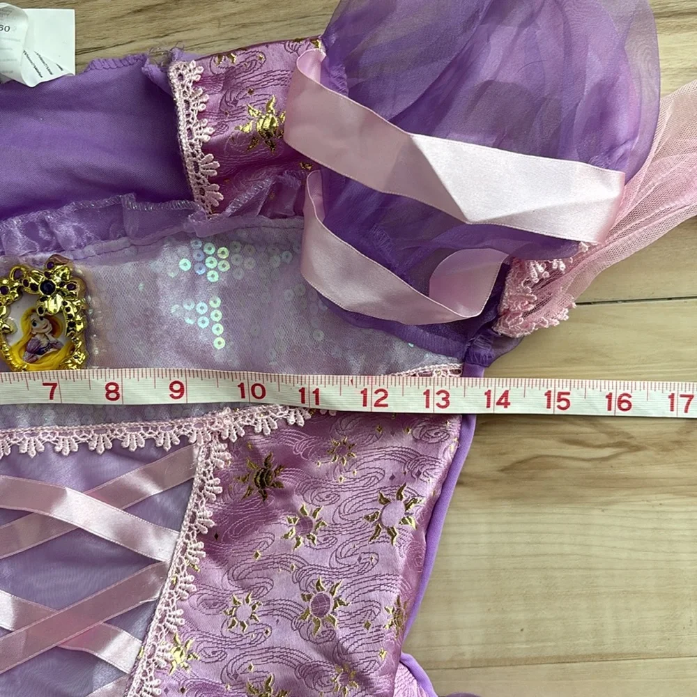 NWT Disney Princess Rapunzel Dress Up Dress. Girls Size M 7/8. Runs long. Pretty